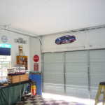 Other side of tracks raised and backhangs cut off. Door is now functional by hand.