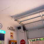 Horozontal rails cut back to give a cleaner look to garage celing.
