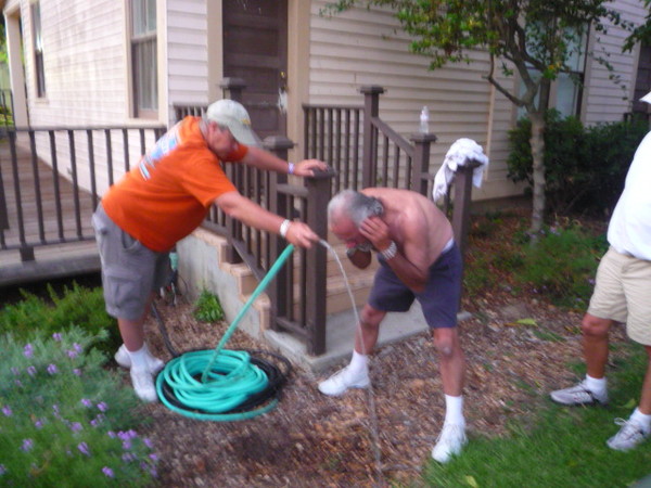 Being a fireman, Don gets the job of hosing down Carl.