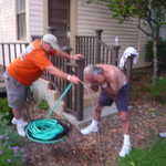 Being a fireman, Don gets the job of hosing down Carl.