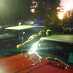 Cindy show off her camaro to an ASI spectator.
