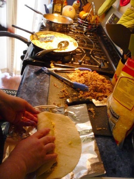 We mass produce a whole mess of carnitas breakfest burritos.
