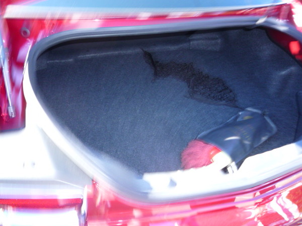 Not much can fit in the new camaro's trunk but some golf clubs and a bottle of Scotch.