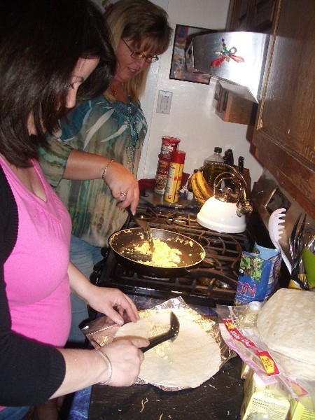 Kim and Sally join forces to whip up a load of food for the event.