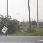Stop that guy!!! He's stealing the entry sign!!