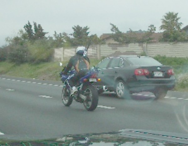 This guy's got golf clubs in his backpack...LOL!!