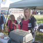 Kim pitches in to help grill some early morning sausages.