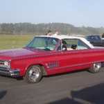 John from Moparts and his cool Chrysler make the scene.