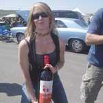 That's a mighty big bottle for such a little lady!