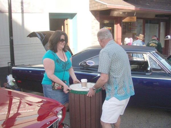 No trash cans allowed next to my car!!