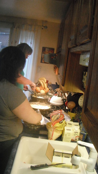 The night before Sally and Kim make 140 breakfest burittos for the show attendies.