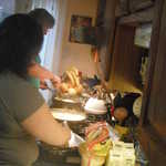 The night before Sally and Kim make 140 breakfest burittos for the show attendies.