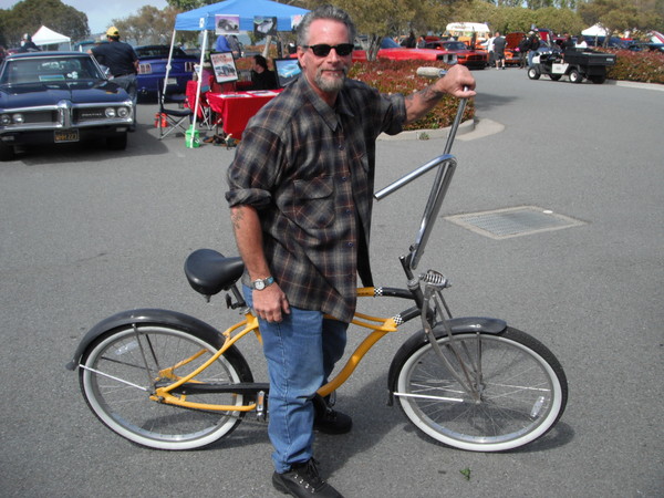 Bad ass biker Tony Lamberti brings out his scooter. Now all he needs is some playing cards in the spokes!