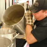 Tony add the water that will cook near 400 hotdogs!