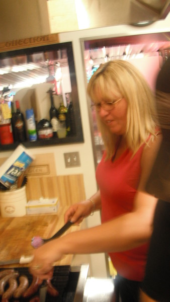 Kim is handy with the knife and cuts the sausage like a pro.