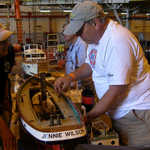 Inside the hanger we see the model boats and trains.