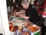 There she is slaving over a hot tray of deviled eggs again! Well maybe a cold tray that is!