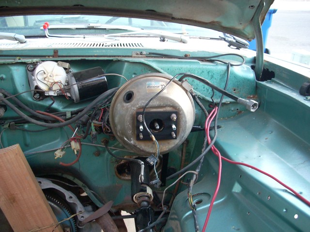 Power booster with adapter plate