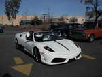 Ginger brings out one of her many, many exotic cars.