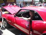 Some spectators getting their photos taken in Kim's 1968 Camaro.
