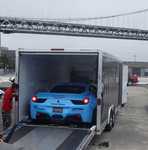 This the "hot" car of the day. Guess it's not street legal so it had to be trailered out to the show. Took them about 1/2 an hour to get if unloaded it was so wedged in there. Note the crazy plastic body kit on a $250,000 car. Meh,,,,,