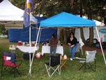 Sally and Deanna are hard at work getting the tent all ready for a weekend of fun.